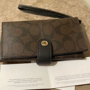 Coach wristlet with pocket for small phone.